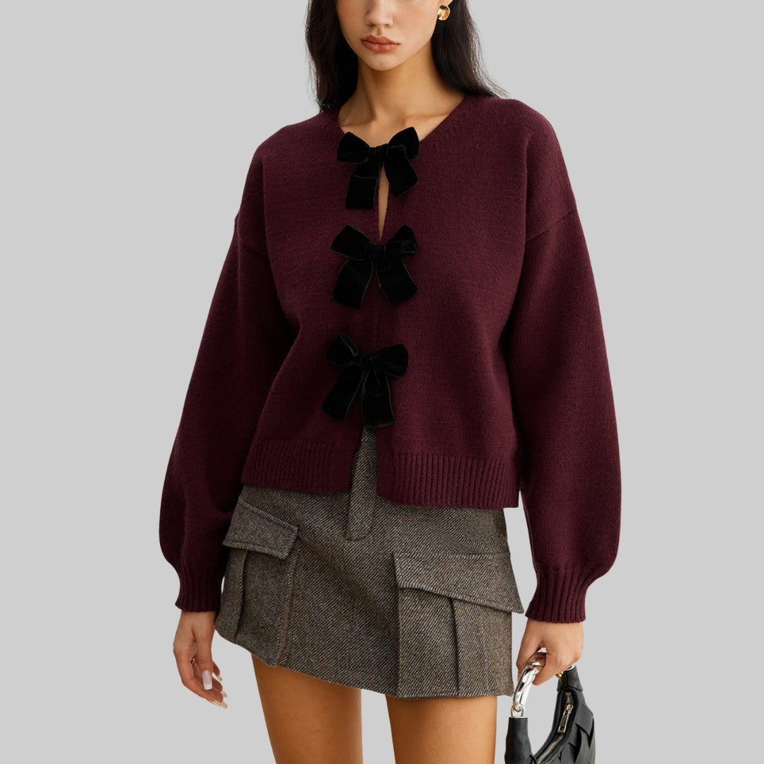 Stickad cardigan med sammetsrosetter och ballongärmar i mjuk stretchkvalitet