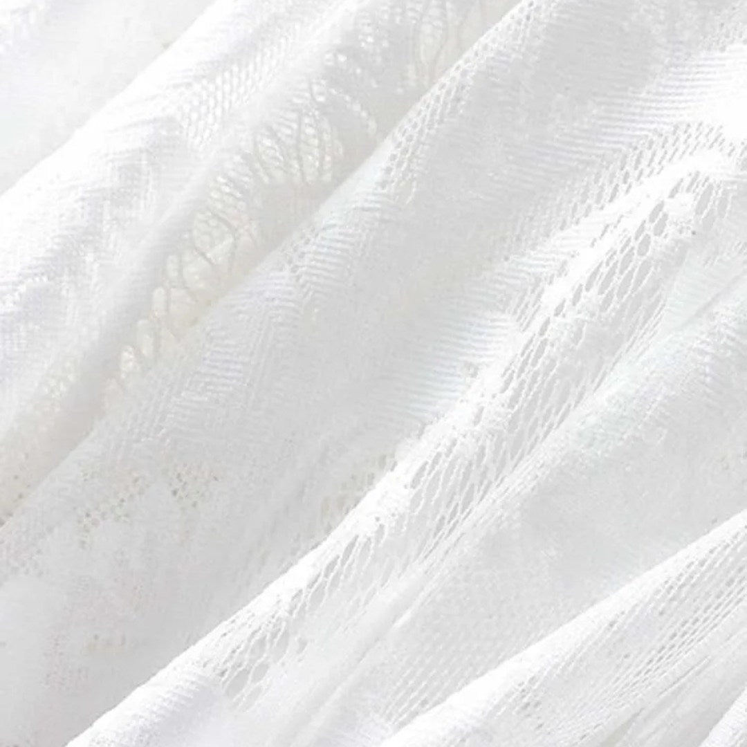 Kjol i spets med naturlig midja, ankellängd, A-linje silhuett och delikat struktur