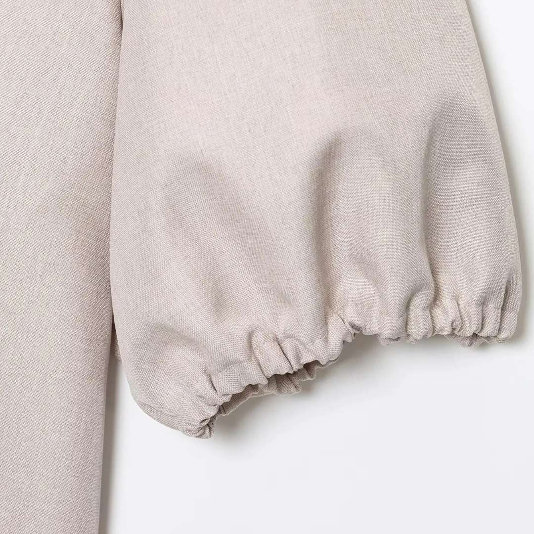 Blus med puffärm och knytband framtill i vävt tyg