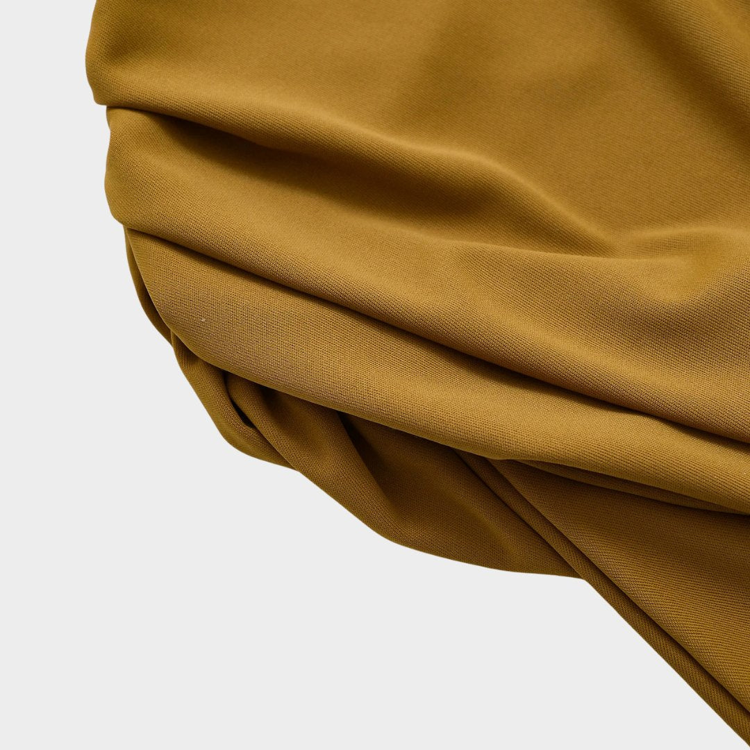 Stickad väst med ränder och asymmetrisk fåll