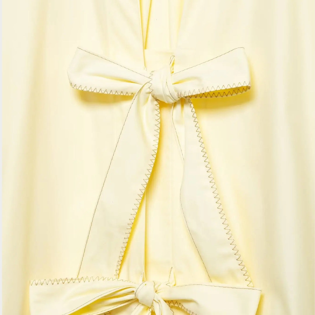 Blus i poplin med knytband och ränder