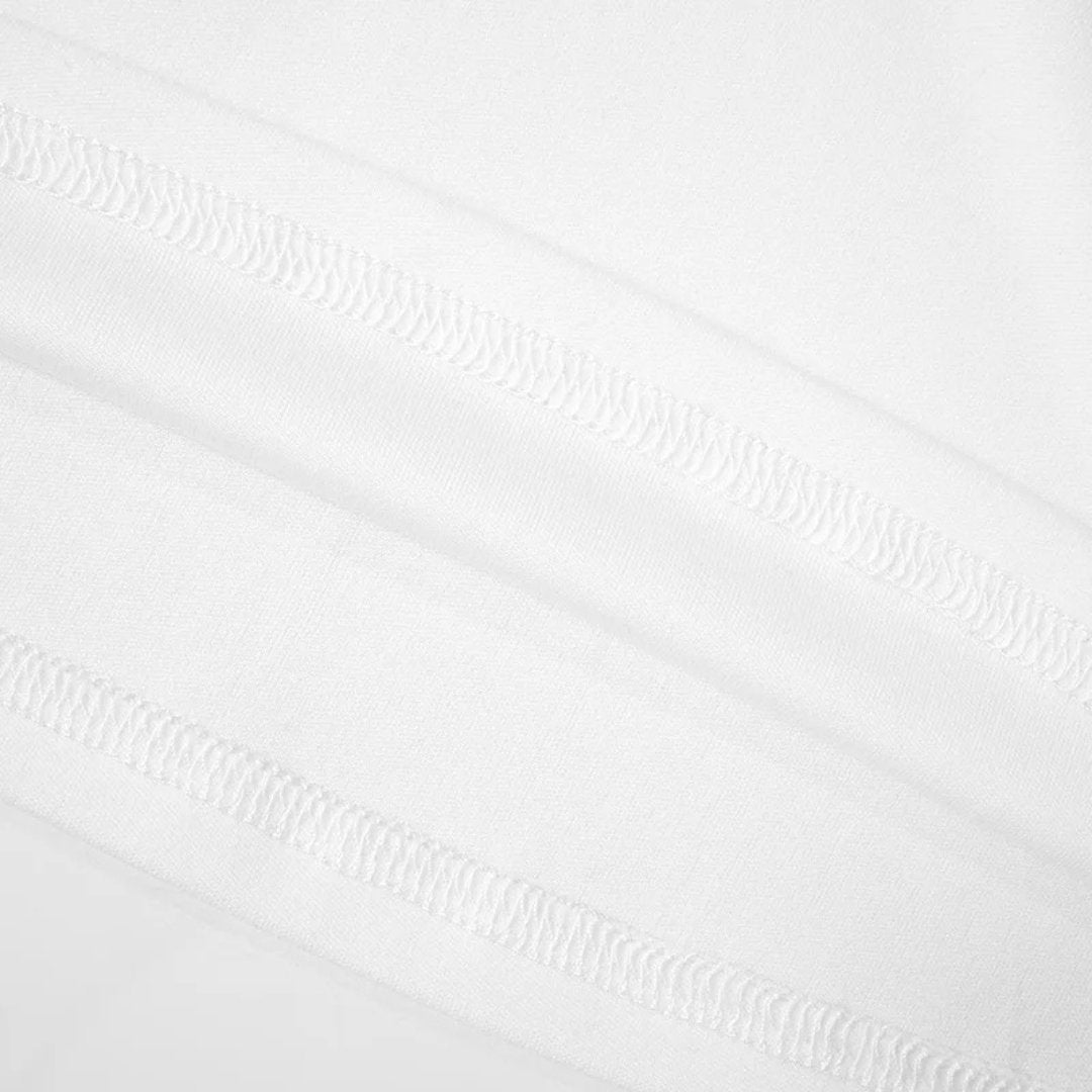 Tvåfärgad trikåklänning med polokrage och halvlånga ärmar