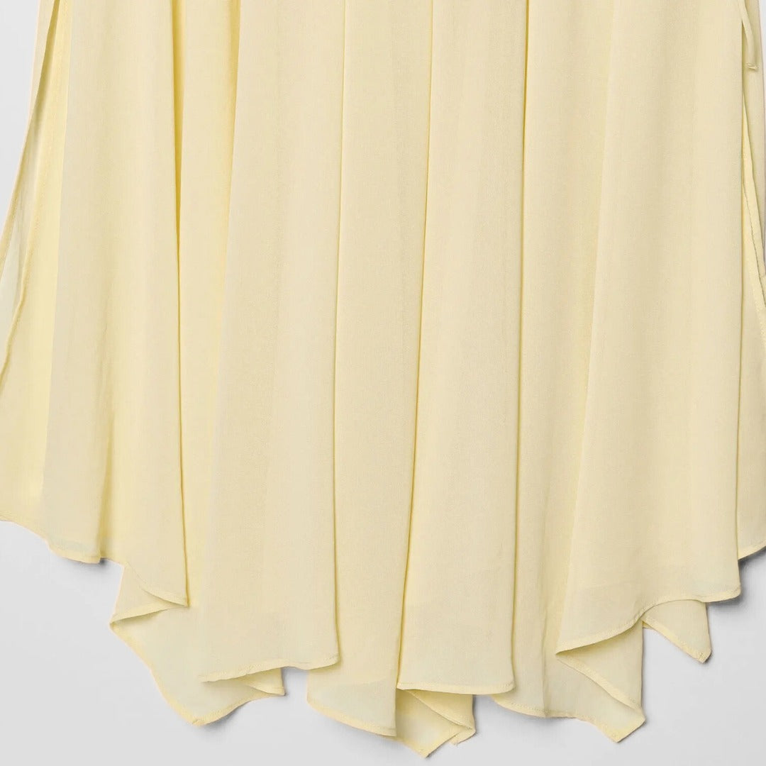 Blus med volangdetaljer och knytband samt asymmetrisk midikjol set