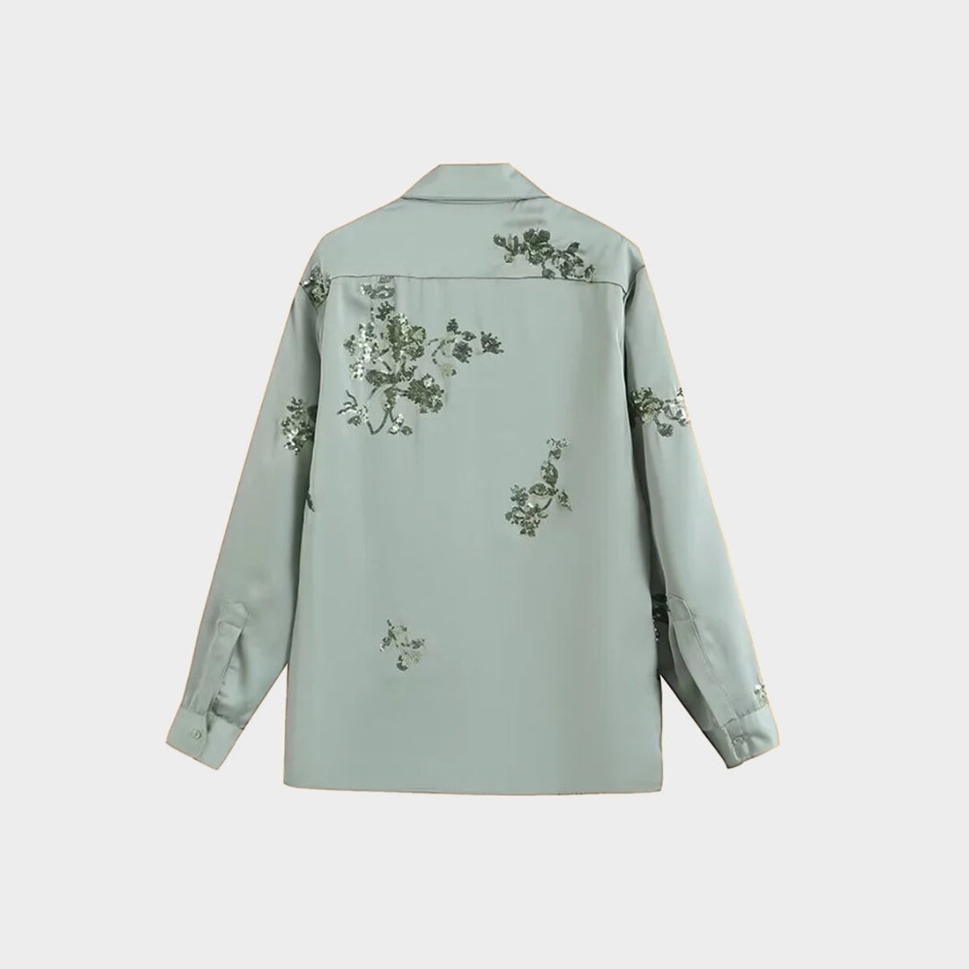 Tvådelat set med blommigt mönster och vida byxor