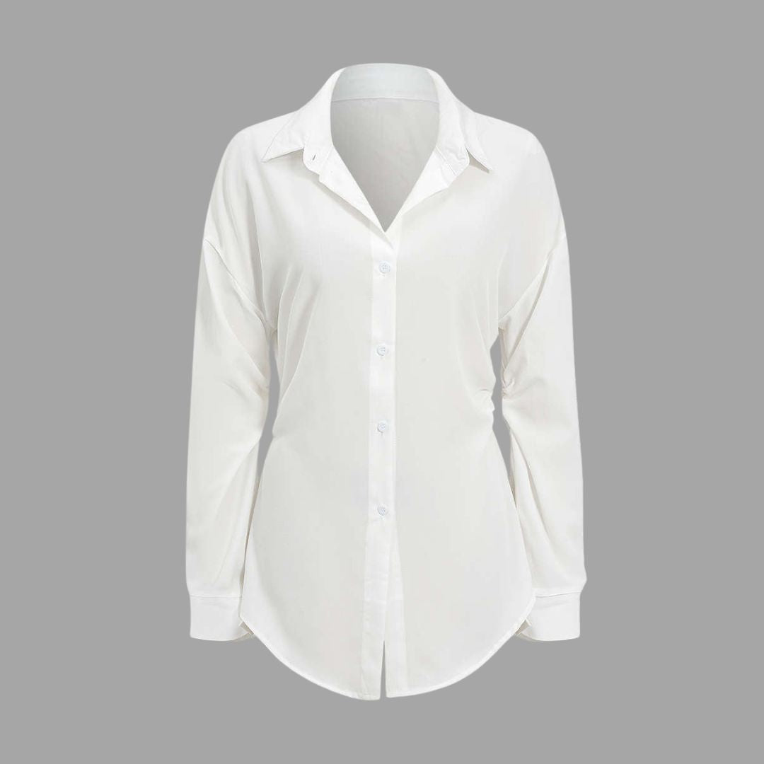 Vit lång skjorta med markerad midja och breda manschetter