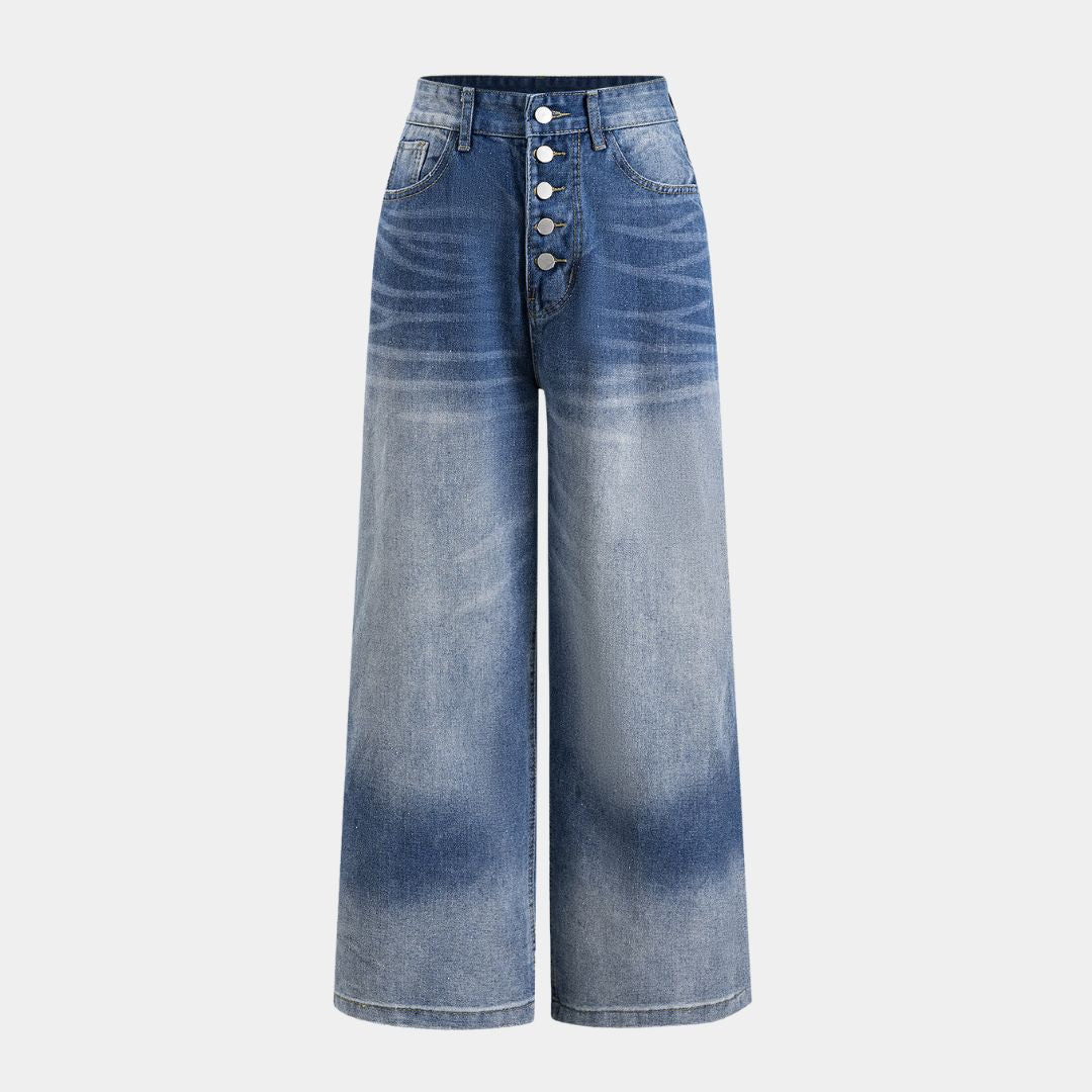 Högmidjade jeans i blekt tvätt med breda ben, markerad knappgylf och slitna detaljer baktill