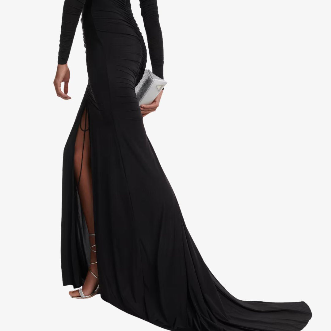 Golvlång stretchig maxiklänning i jersey med djup V-ringning, rynkdetaljer och långa ärmar