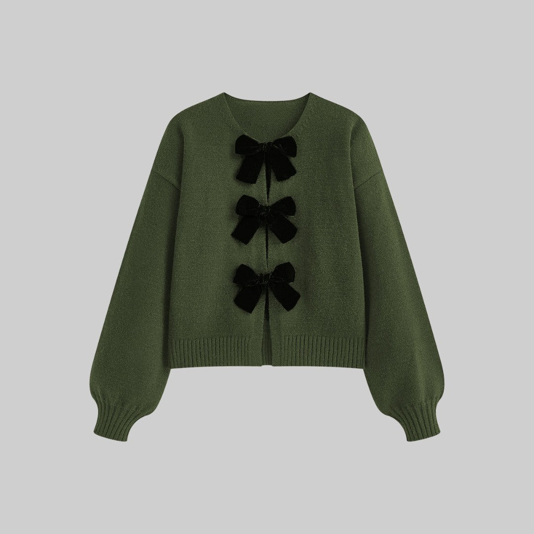 Stickad cardigan med sammetsrosetter och ballongärmar i mjuk stretchkvalitet