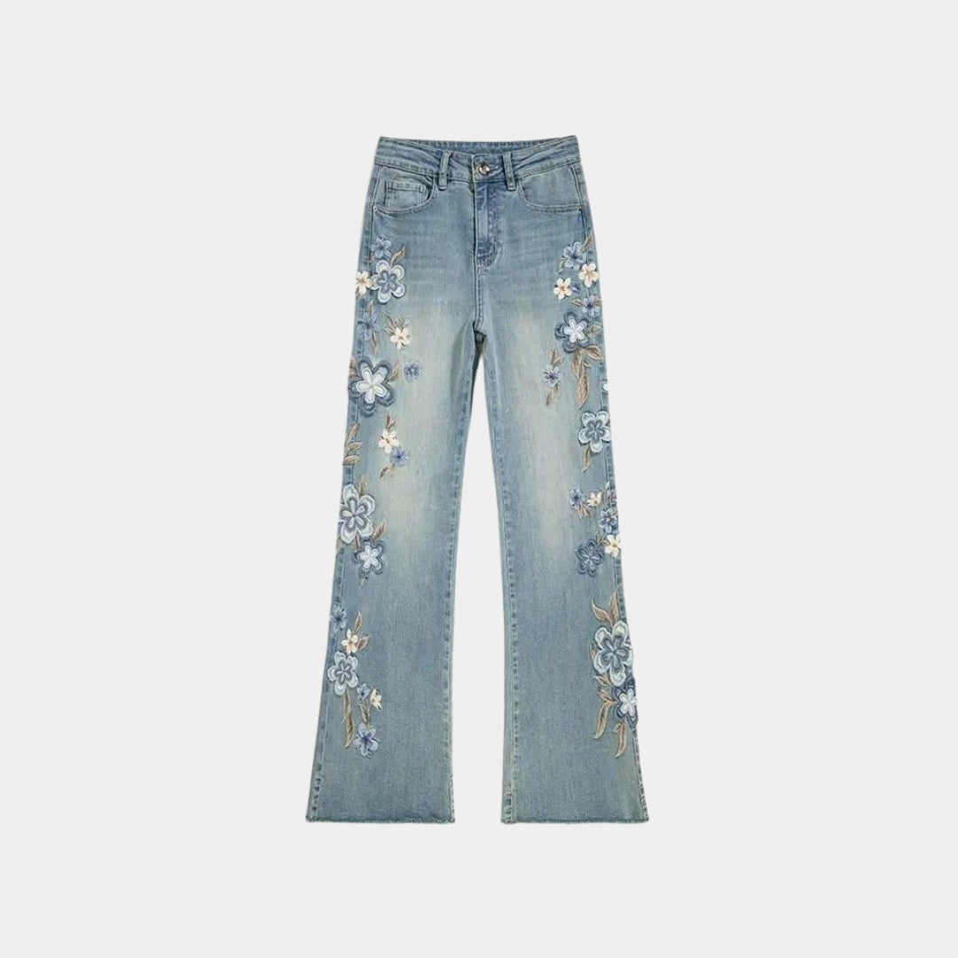 Rak jeansmodell med broderade blommor och utställda benslut