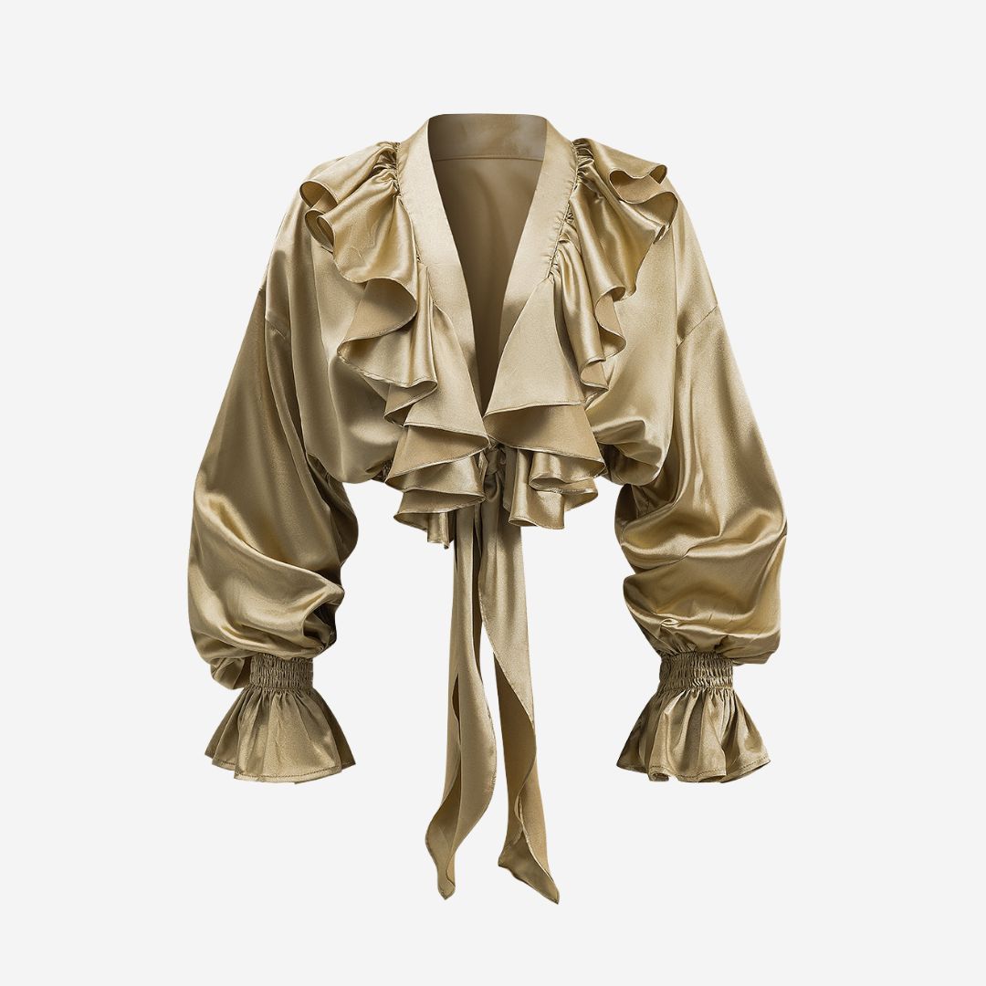 Voluminös satinblus med romantiska volangdetaljer, knytband framtill och smockade ärmslut för en sofistikerad touch