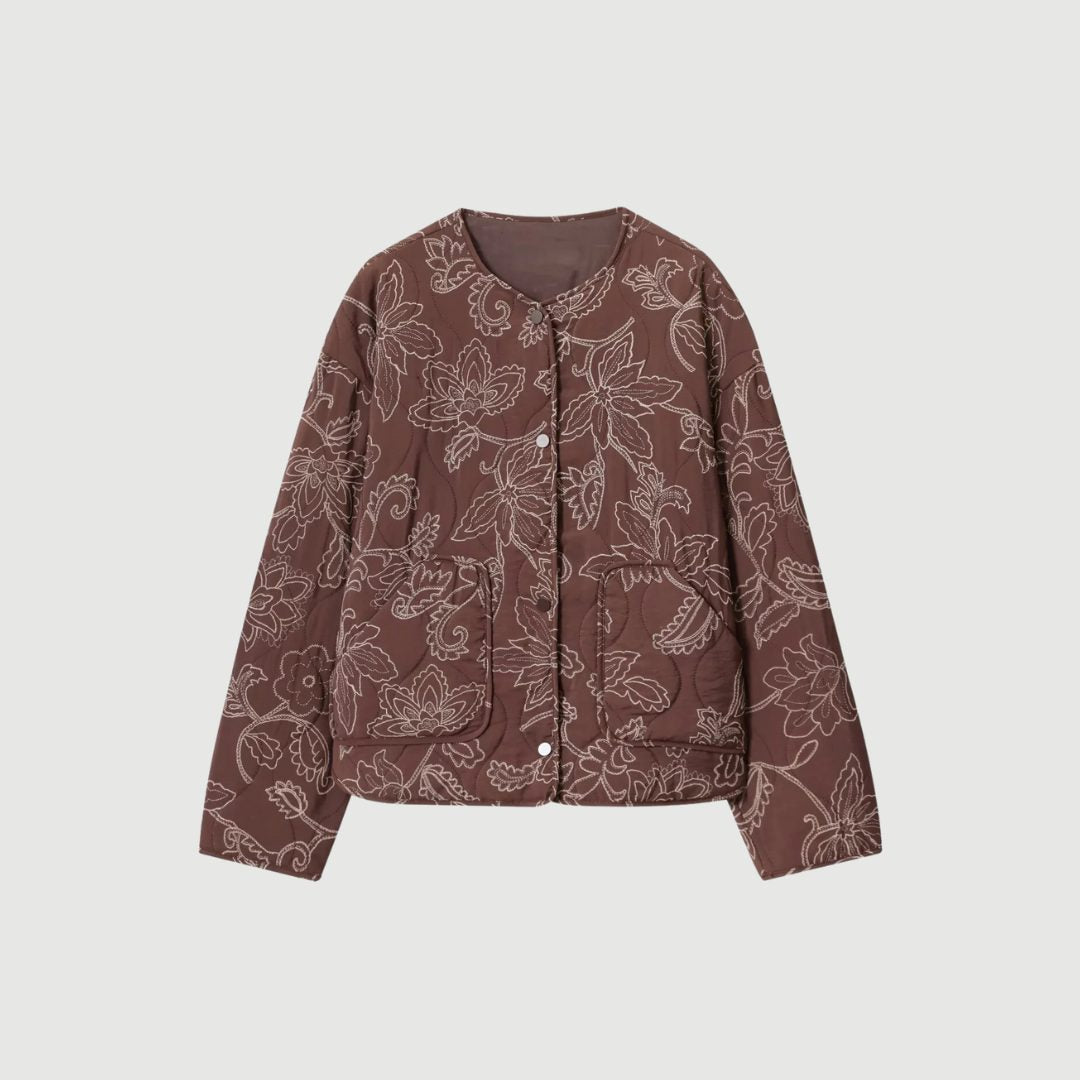 Kort blommönstrad vadderad jacka med broderi och rund hals