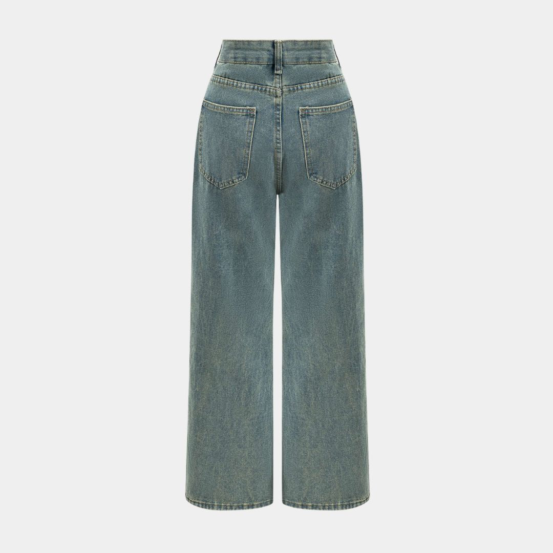 Höga ljusblå jeans med kraftiga slitningar, transparenta infällningar och bred rak passform i strukturerad denim