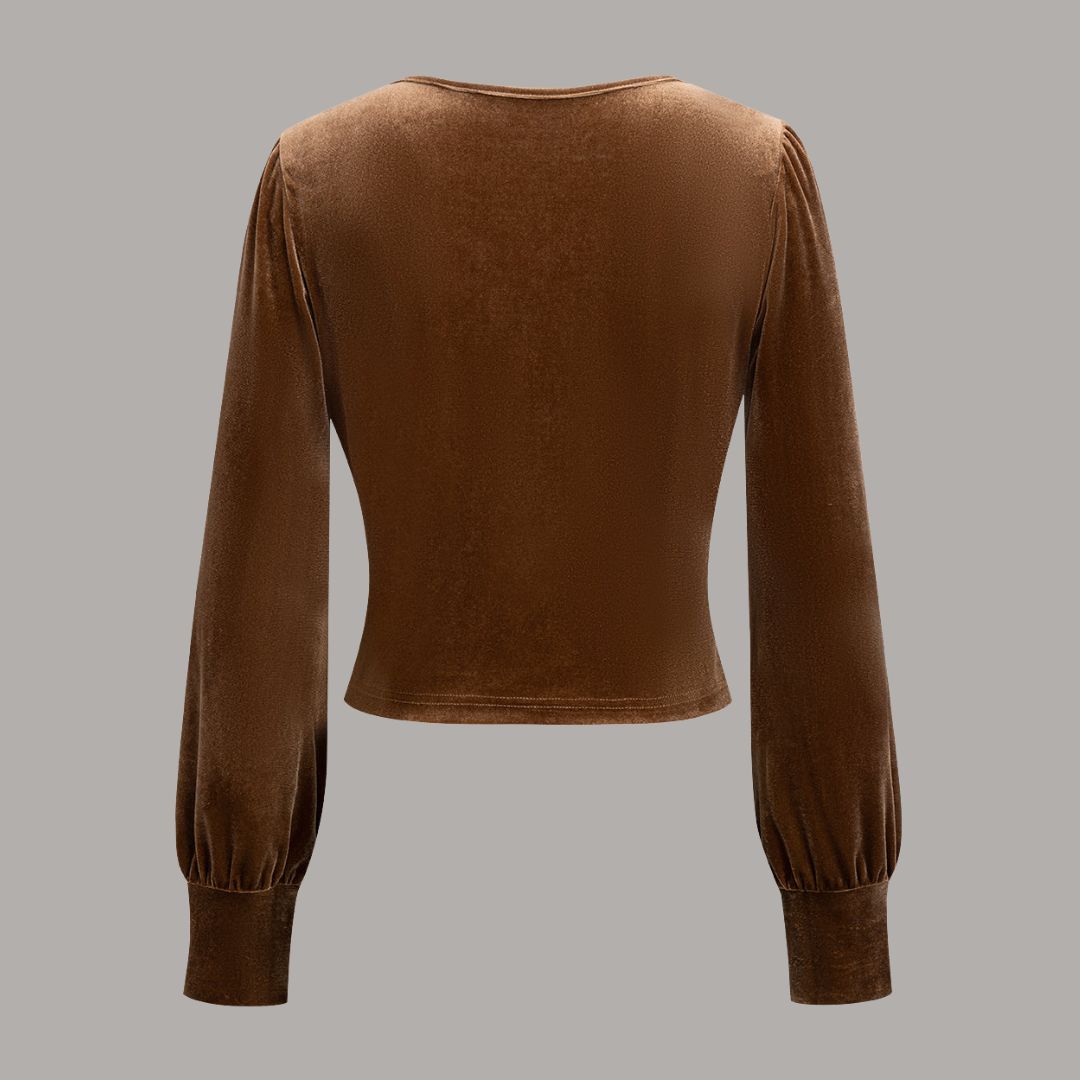 Brun sammetsblus med lång ärm och tvistad drapering i midjan