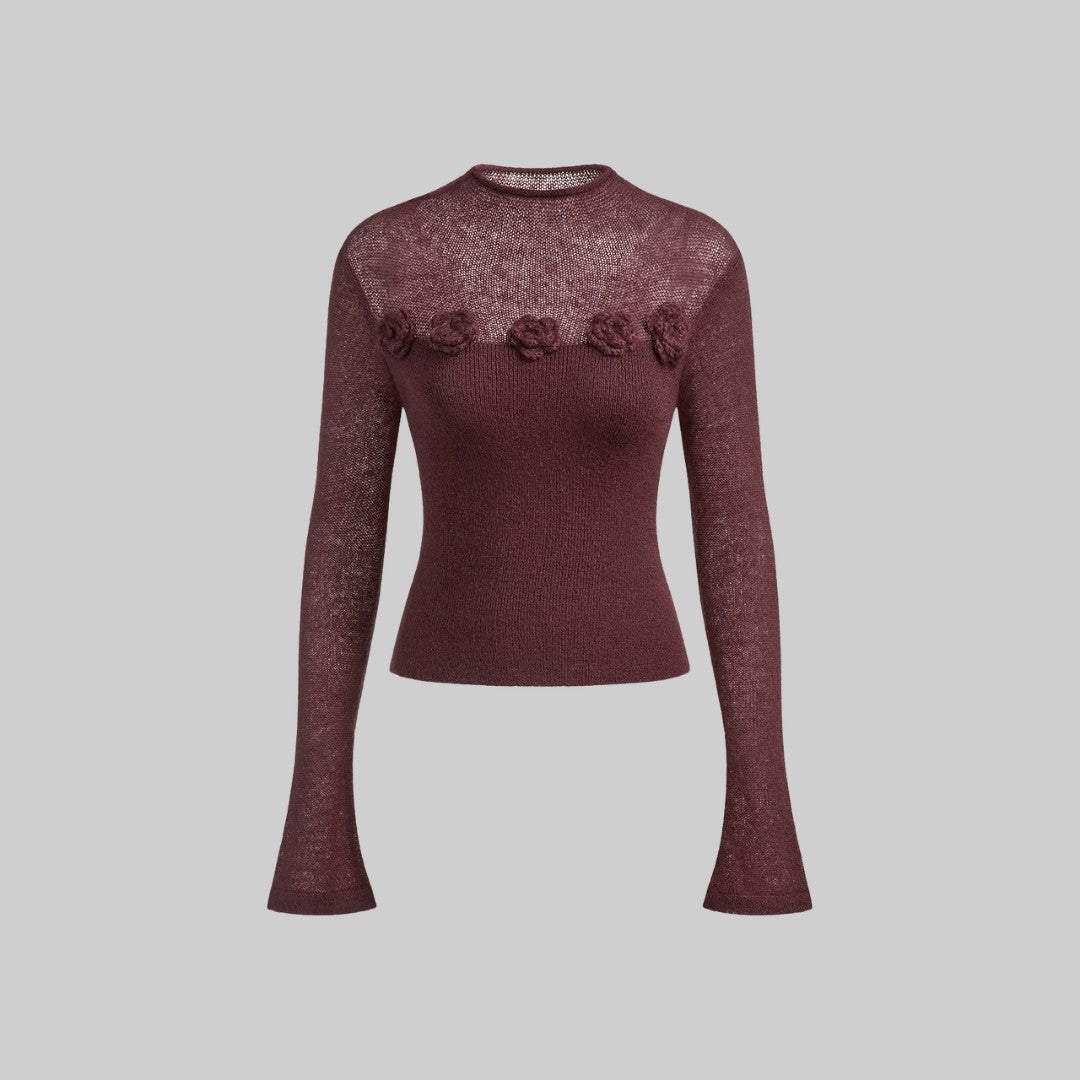 Tunn stickad topp med 3D-blommor och transparent överdel i ullmix