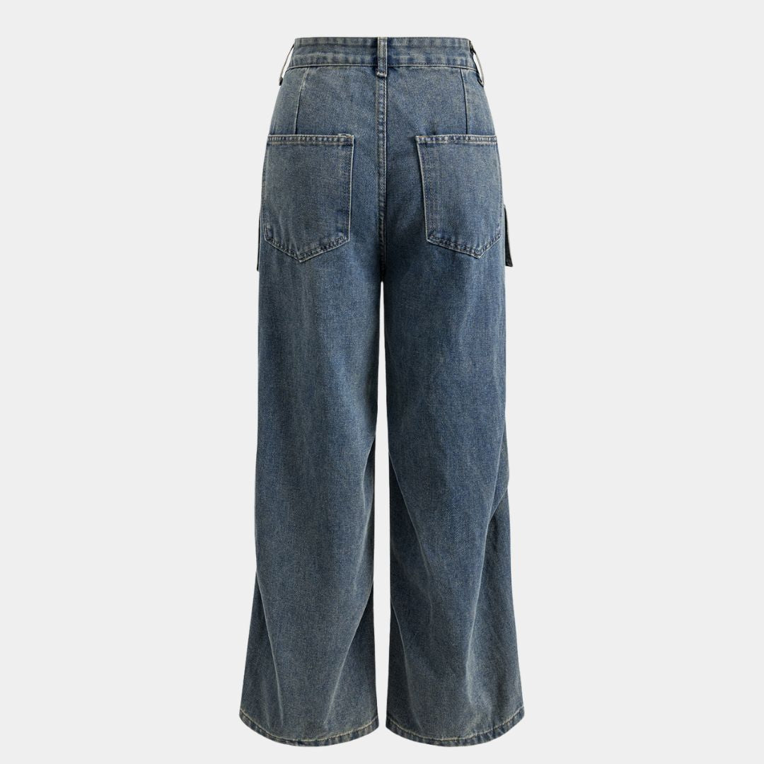 Blå cargojeans i denim med utanpåliggande fickor, lös passform och tvättad yta i bomullsblandning