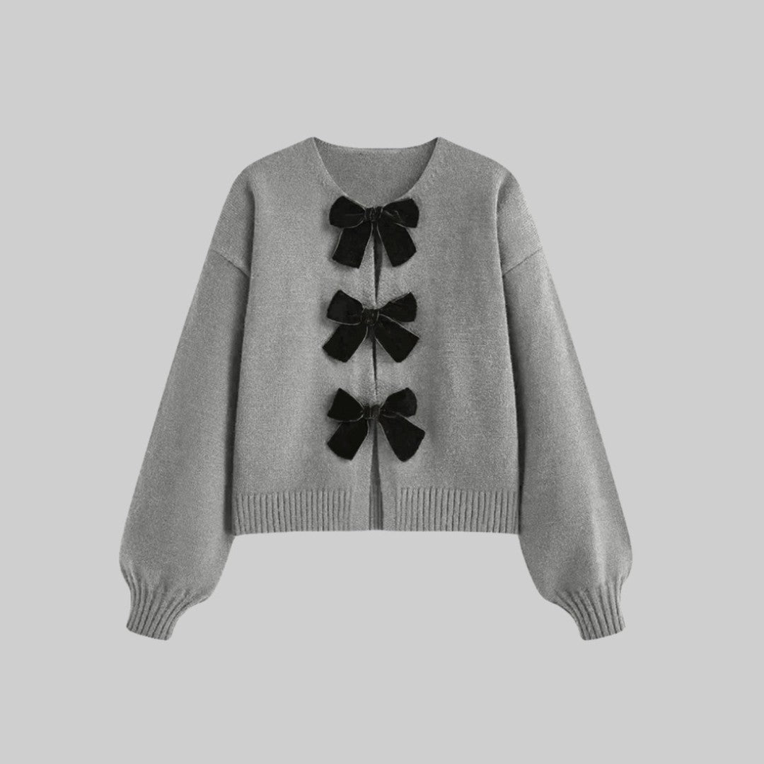 Stickad cardigan med sammetsrosetter och ballongärmar i mjuk stretchkvalitet