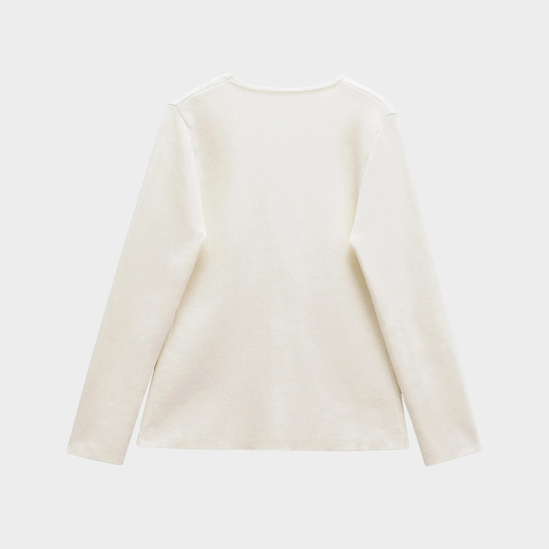 Pastellfärgad stickad kofta med V-ringning och guldfärgad knapp