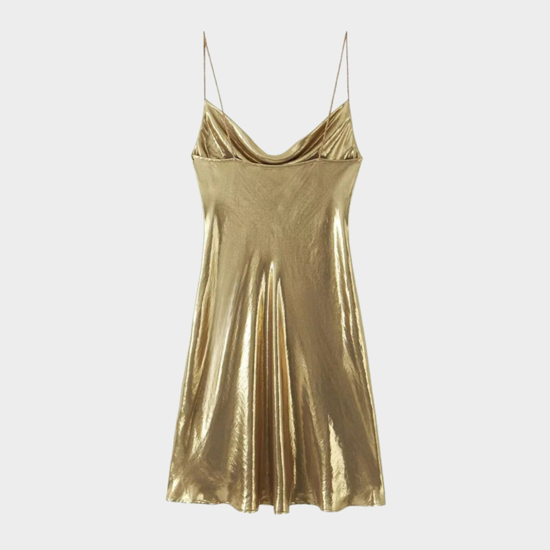 Glittrande miniklänning med smala axelband och öppen rygg