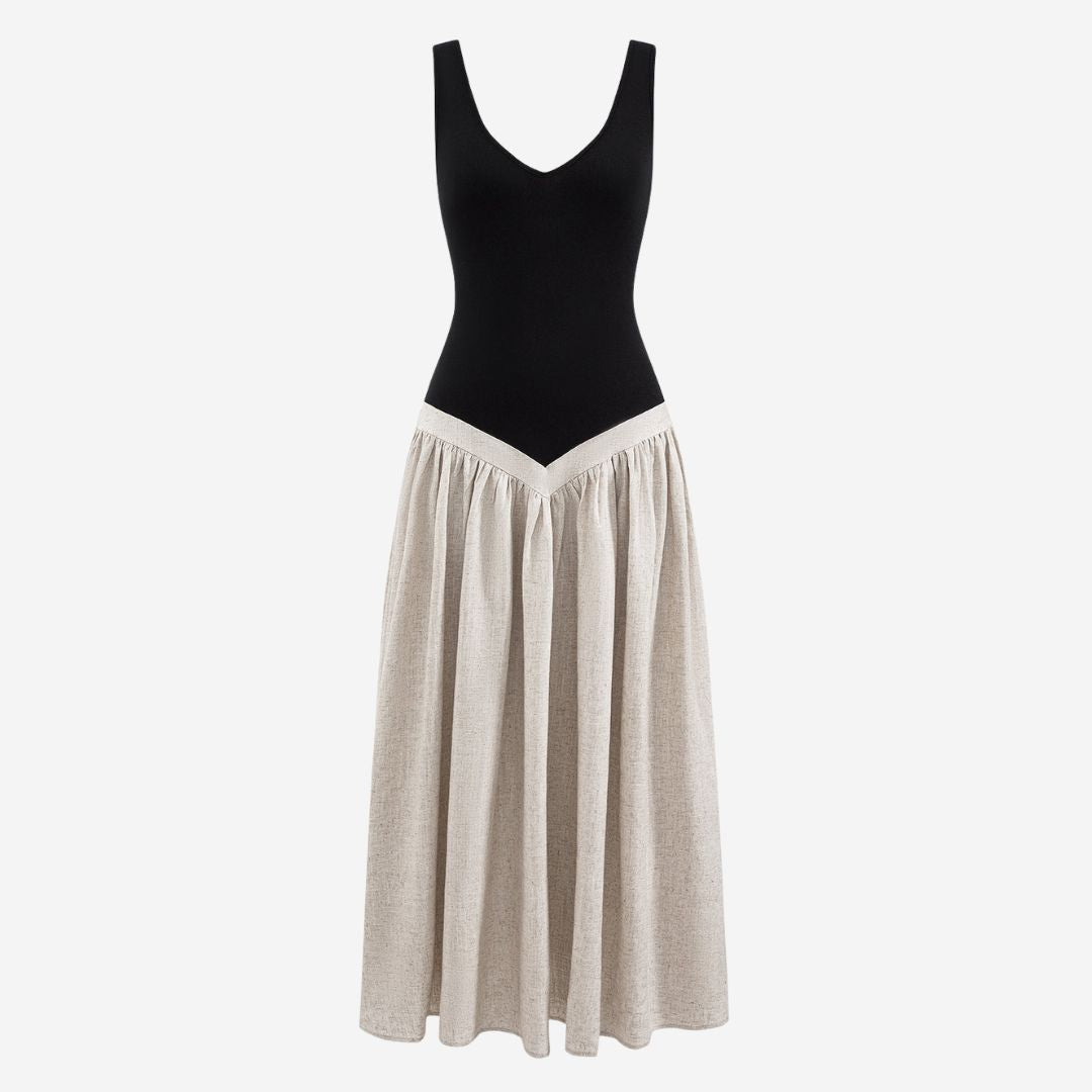 Svart tvåfärgad klänning med linnelook och figurnära överdel