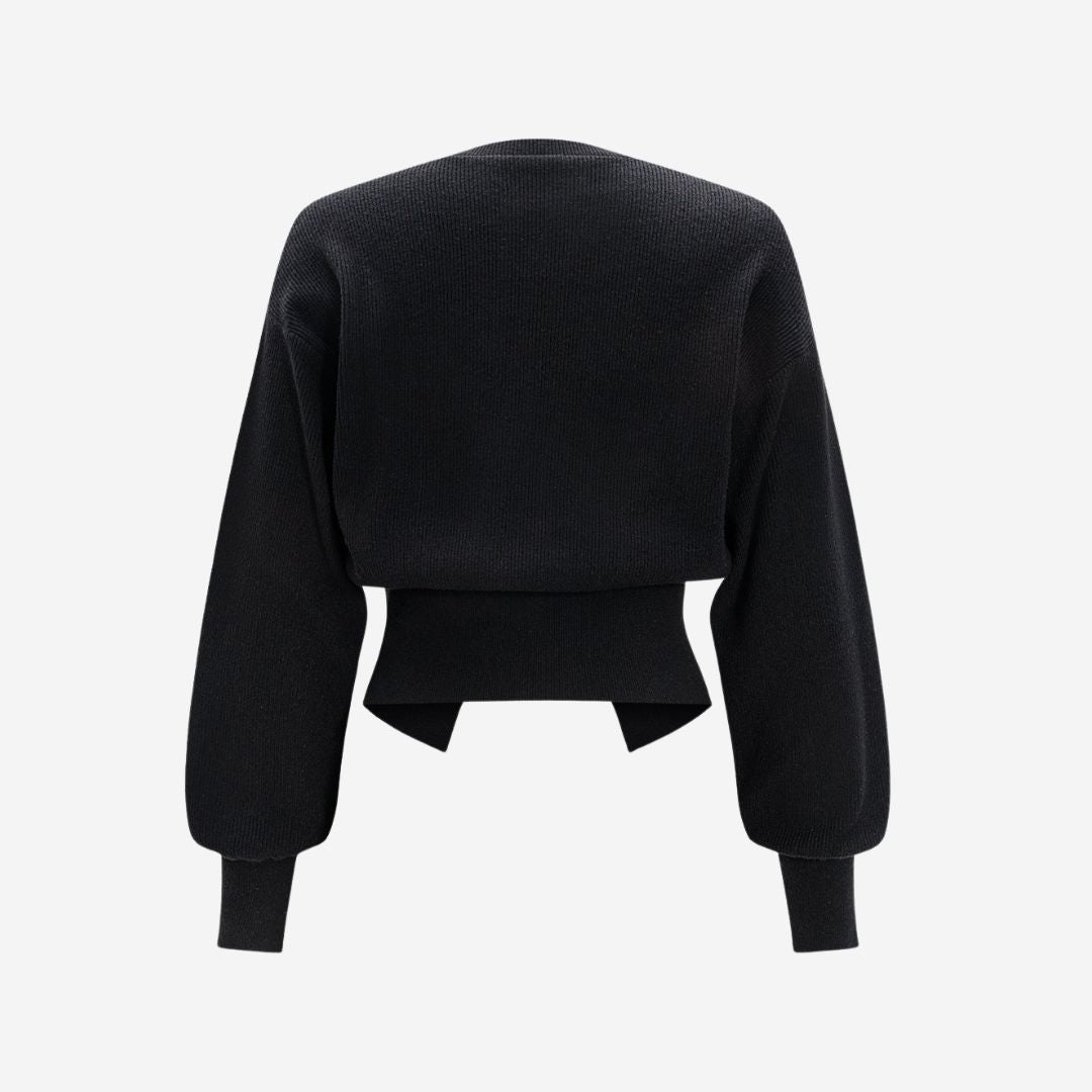 Svart figursydd stickad kofta i ribbat material med guldfärgade knappar och rund halsringning för dam