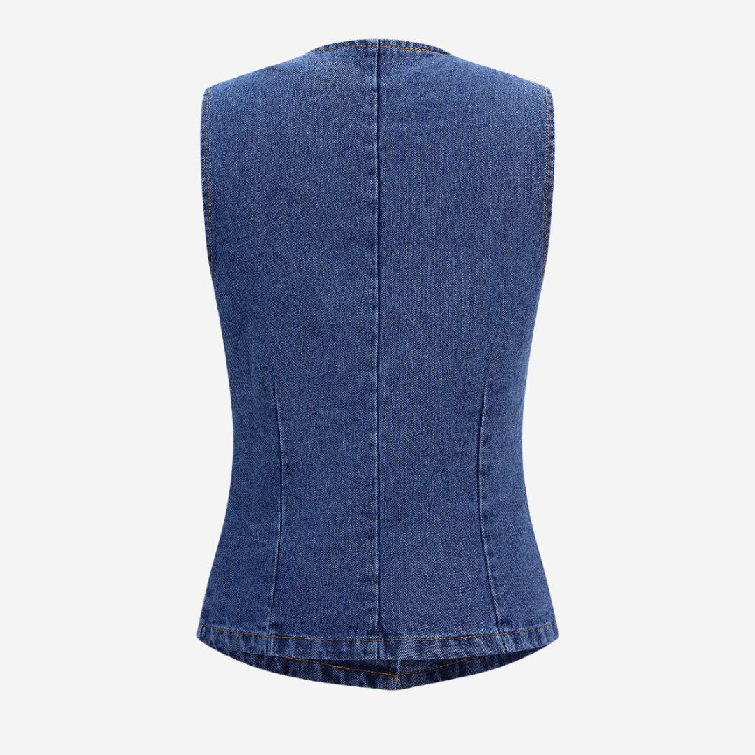Ärmlös asymmetrisk jeansväst med markerade knappar och figurnära passform