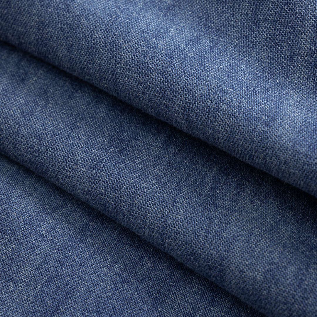 Blå omlottinspirerade denimbyxor med knytband i midjan, vida ben och sömdetaljer över knäna