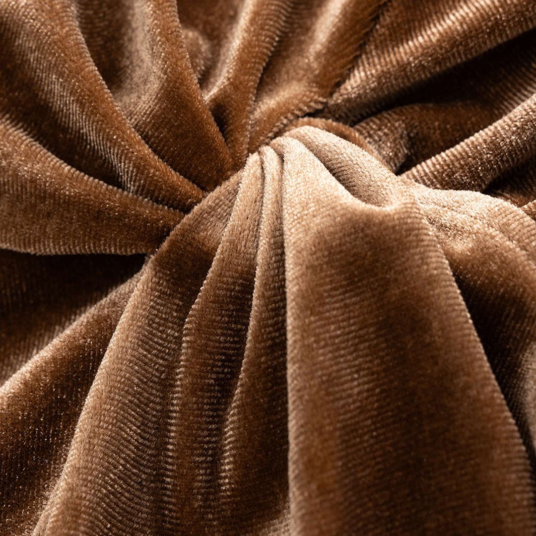 Brun sammetsblus med lång ärm och tvistad drapering i midjan