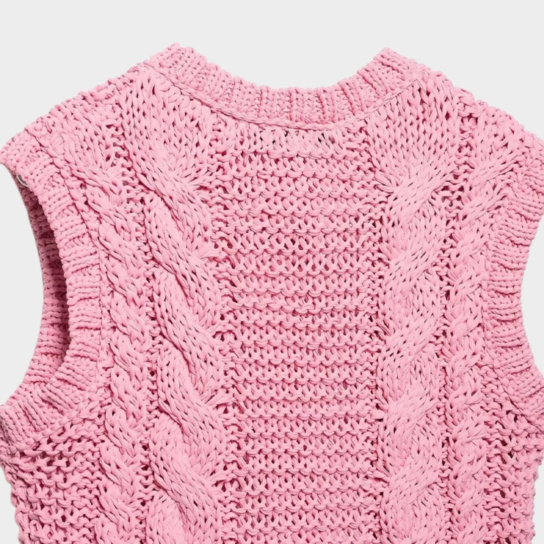 Rosa kabelstickad kofta utan ärmar med blomknappar