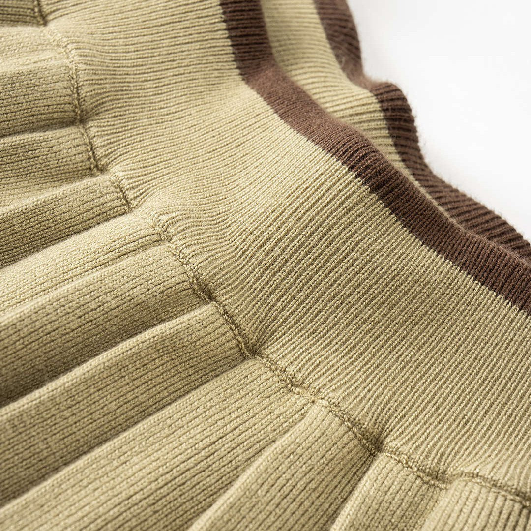 Kort plisserad minikjol i trikå med elastisk midja och låg stretch