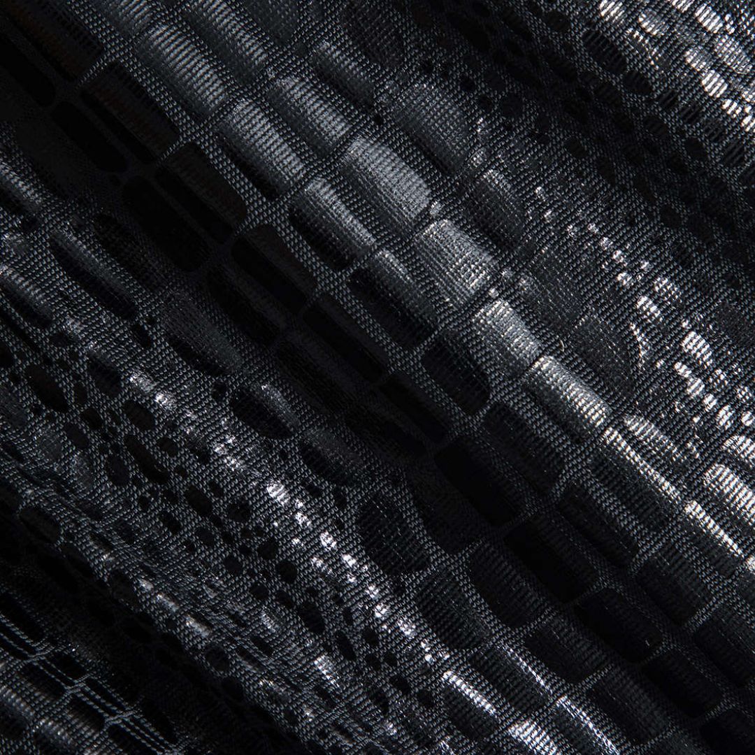 Midiklänning med långärmad topp i glansig krokodilpräglad imitation och draperad kjol i jersey med hög slits