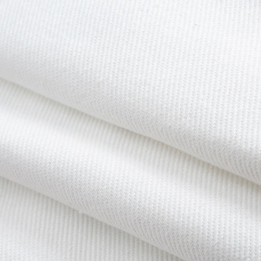 Vita vida jeans med blombroderi och utskurna detaljer