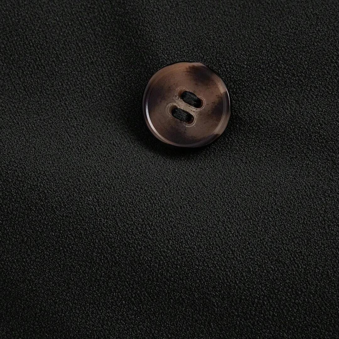 Ärmlös byxdress med kavajkrage och raka ben