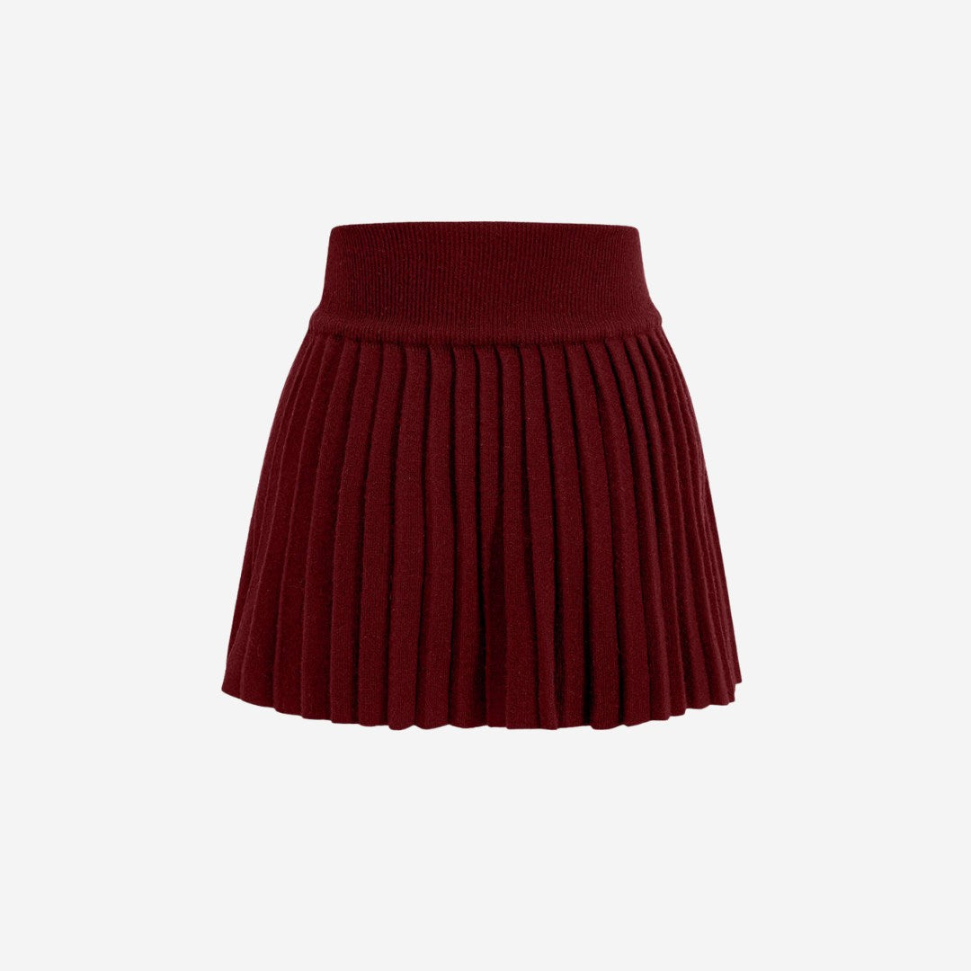 Plisserad stickad minikjol med elastisk midja och klassisk silhuett i mjuk ribbstickning