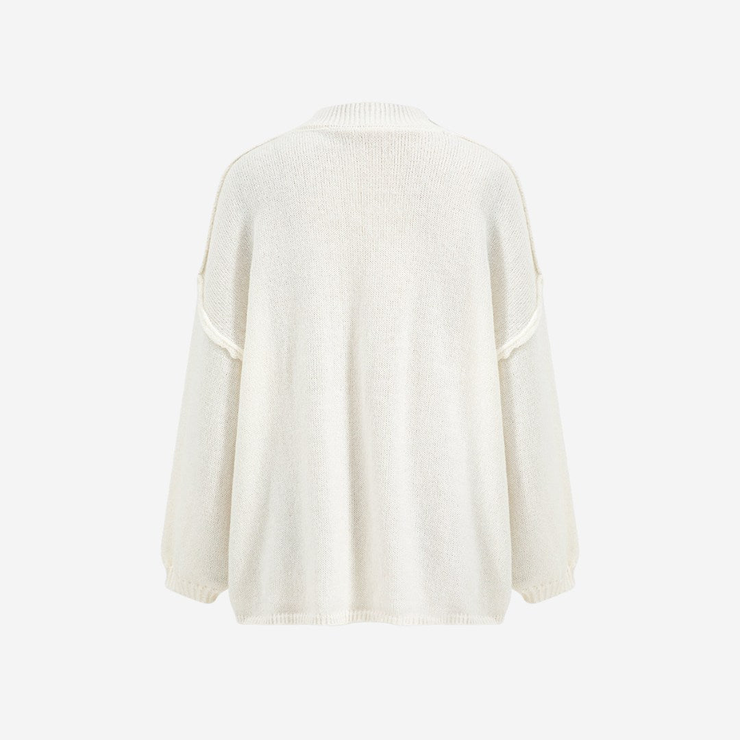 Stickad kofta med rund hals, knappstängning och långa ärmar med ribbade muddar