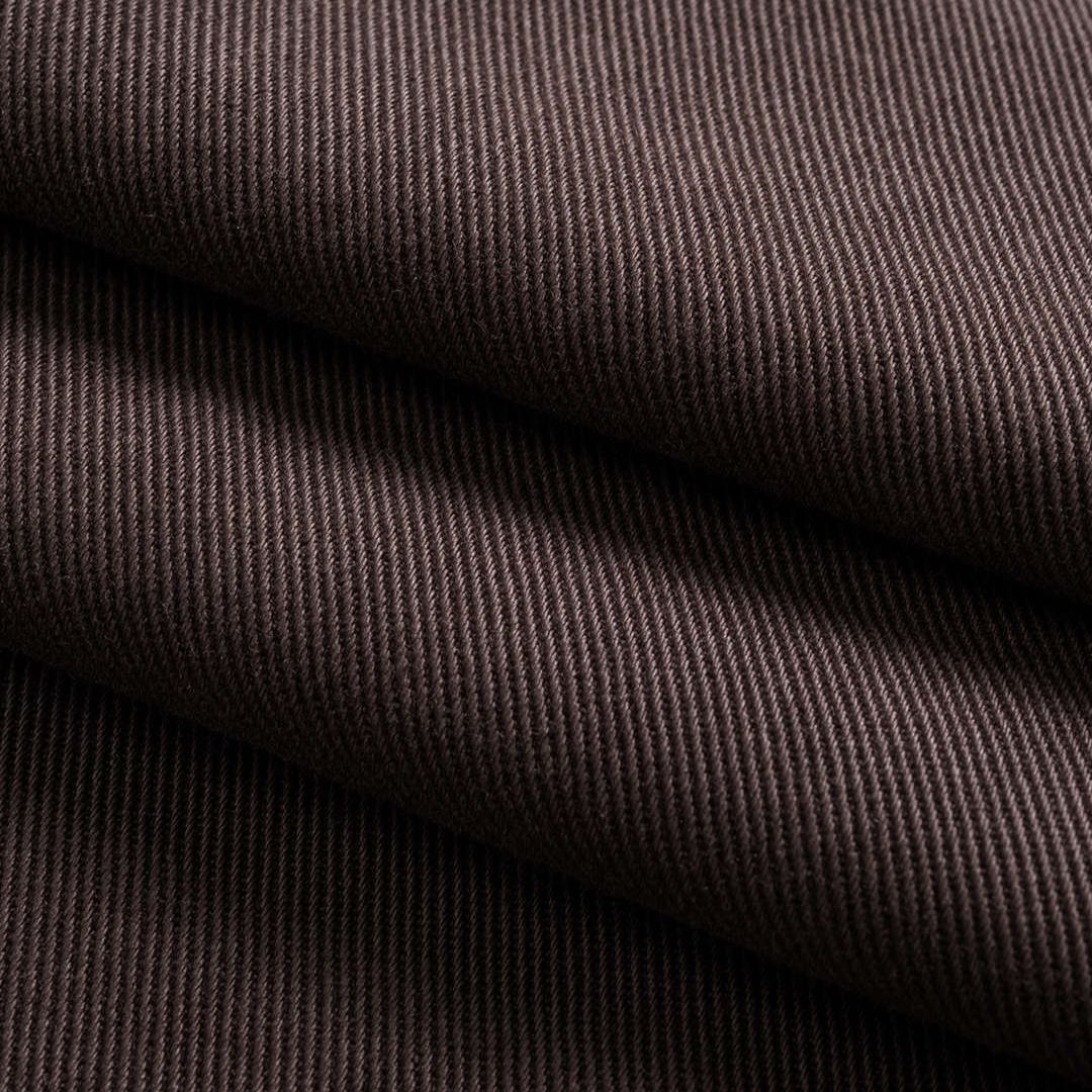 Kaffebruna utsvängda denimbyxor med knytband, träpärlor och flätad bältdetalj i midjan