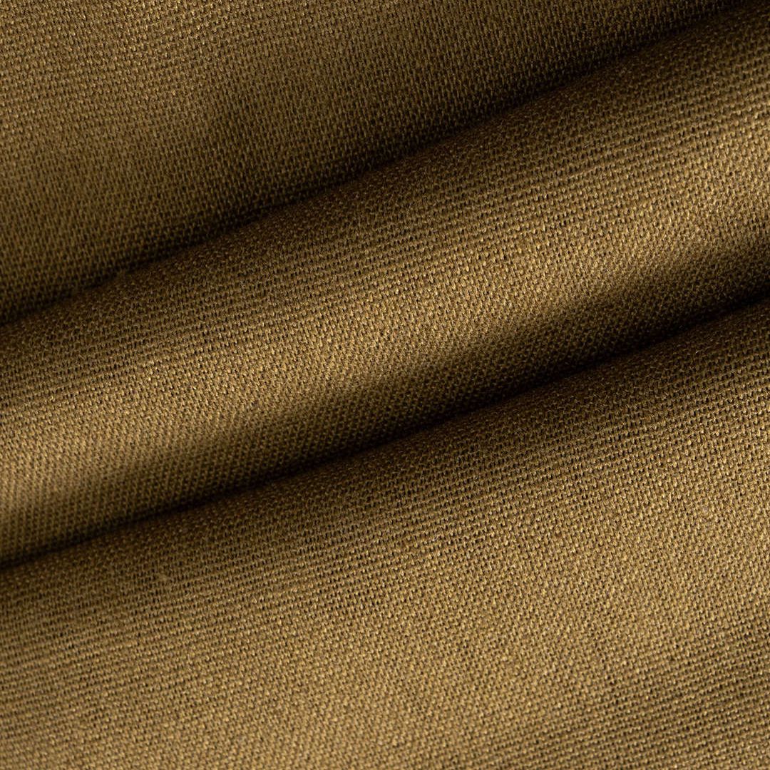 Ärmlös brun midiklänning i twill med halterneck, figurnära passform och dekorativa stendetaljer