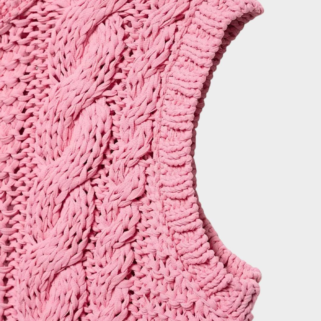 Rosa kabelstickad kofta utan ärmar med blomknappar