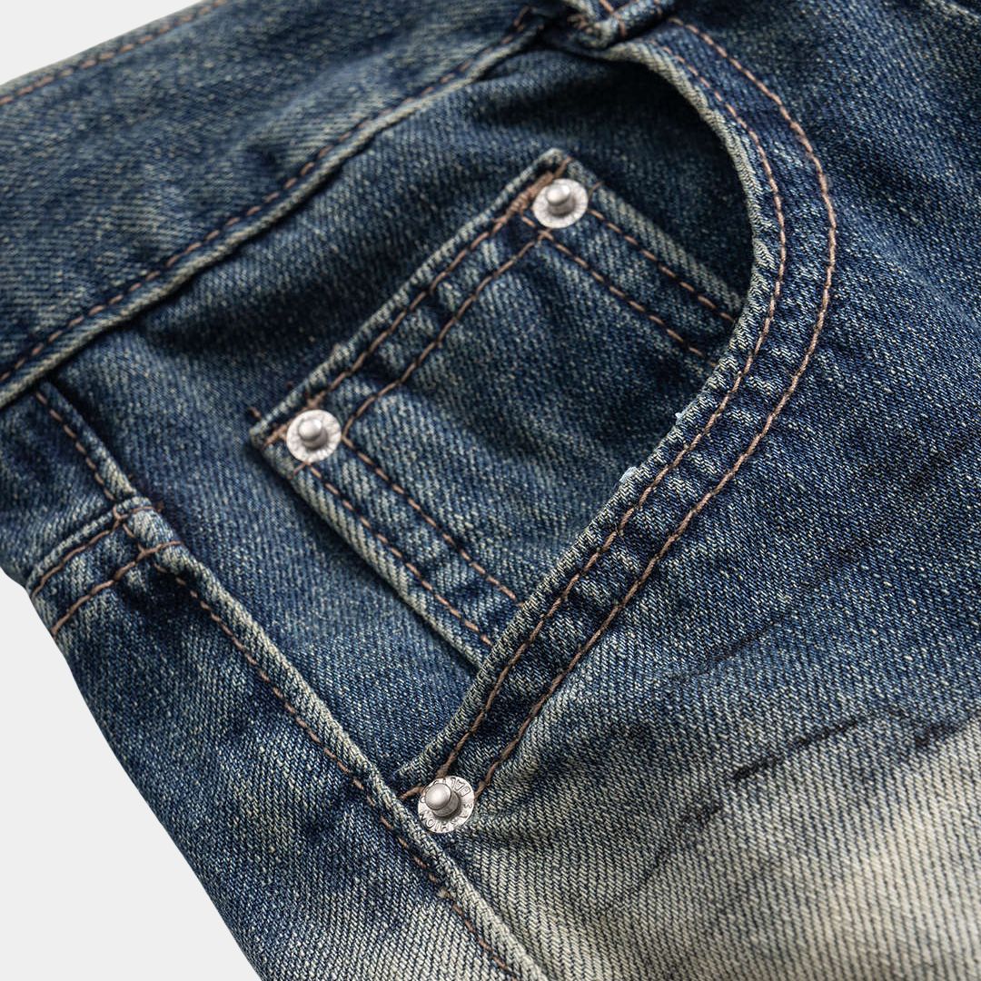 Tvåtonade denimjeans med vågformade paneler, hög midja och breda ben i kraftig bomullsblandning