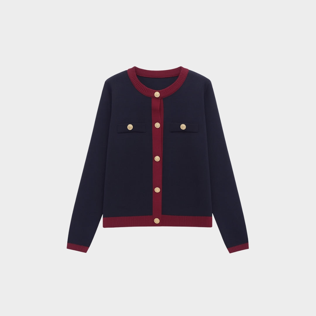 Elegant kort kofta med kontrastkant och guldfärgade knappar