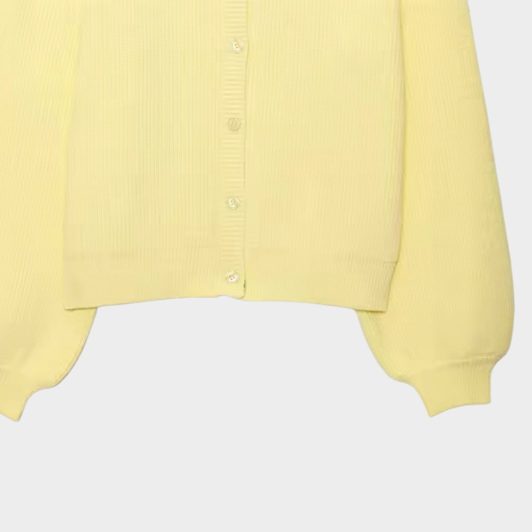 Gul stickad tröja med ballongärmar och knäppning