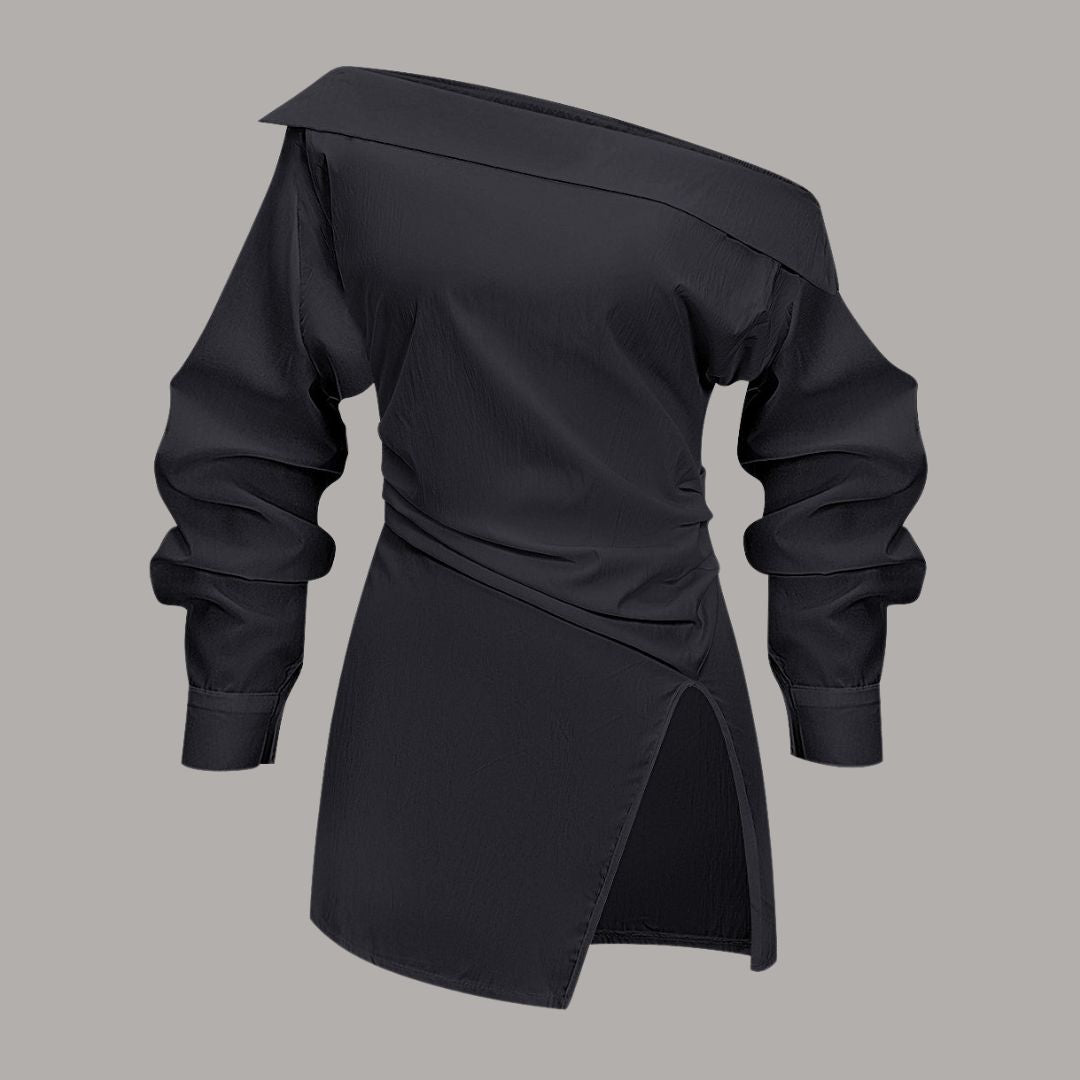 Asymmetrisk topp med bar axel och markerad midja stilren design med skulptural silhuett