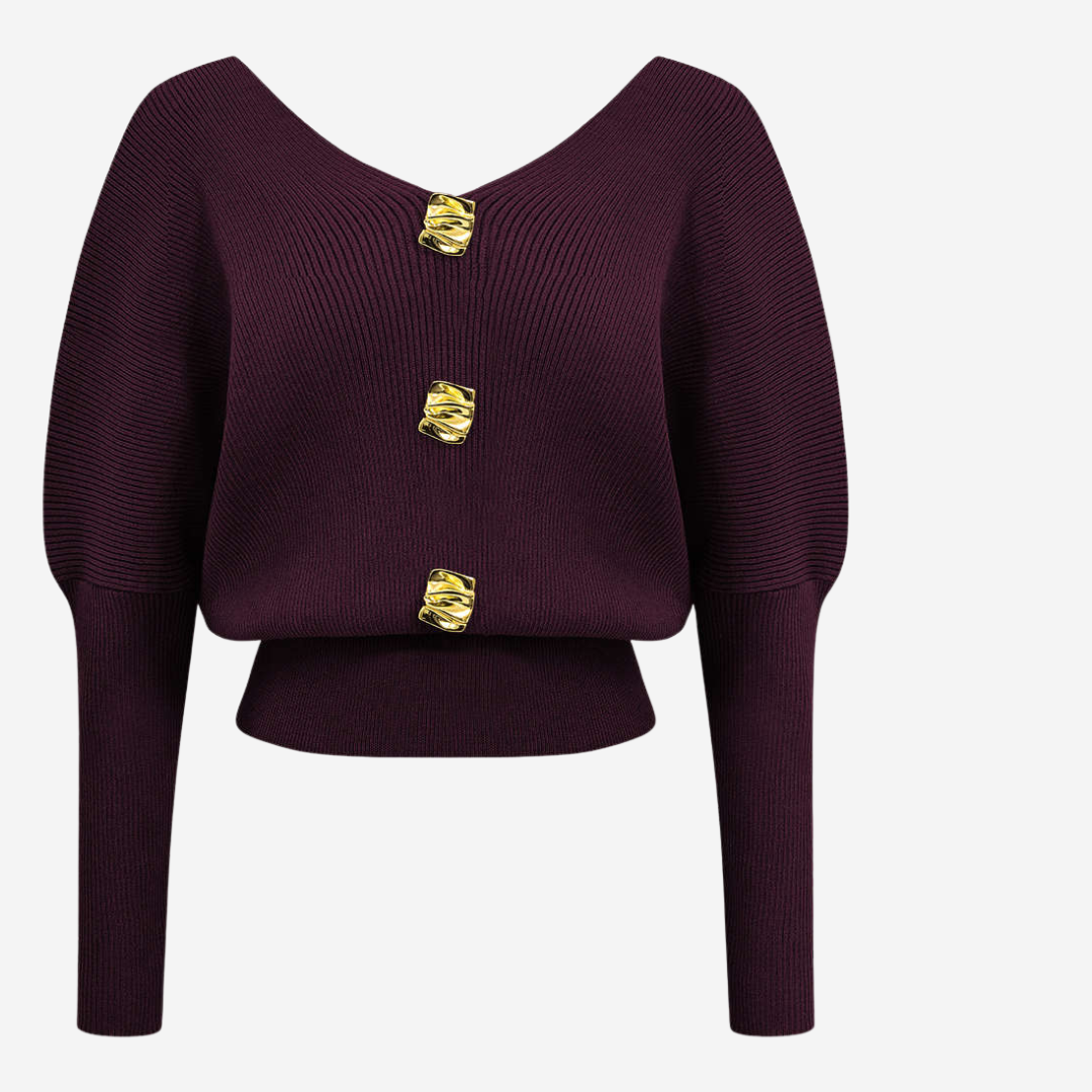 Stickad topp med dekorativa knappar och djup urringning för elegant vardagsstil