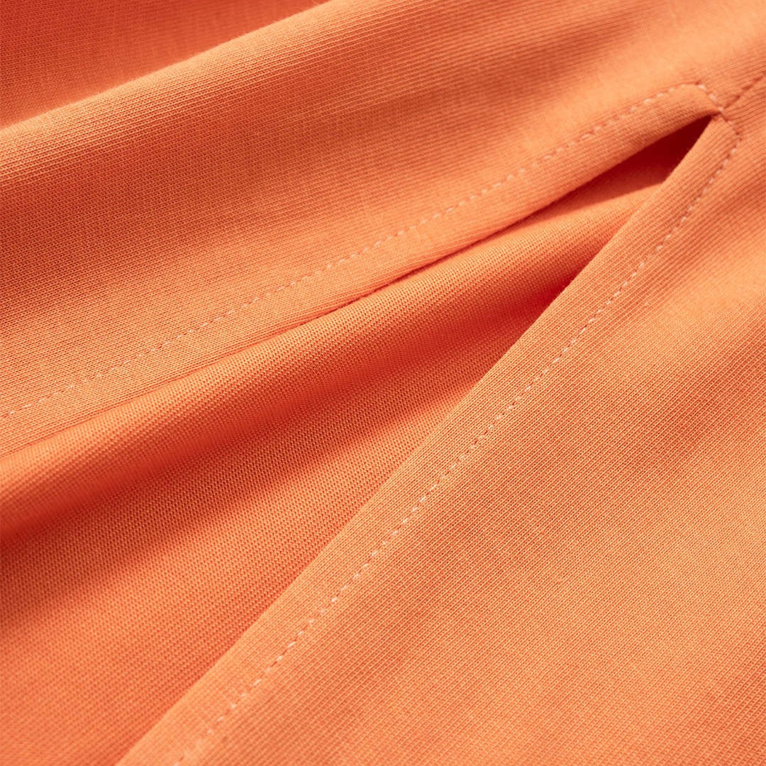 Orange cut-out midiklänning i bomull med knytdetalj och hög slits