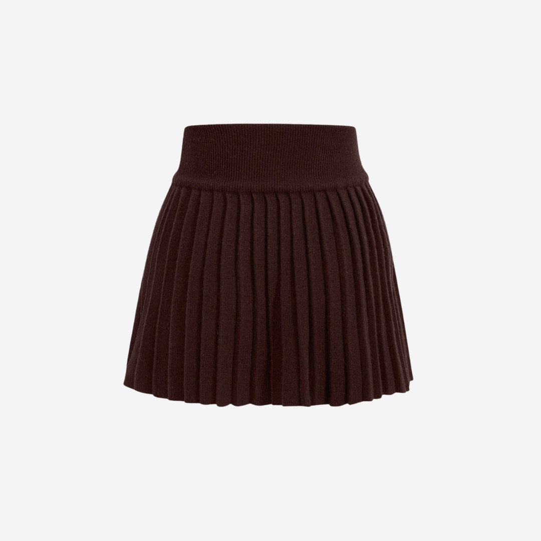 Plisserad stickad minikjol med elastisk midja och klassisk silhuett i mjuk ribbstickning