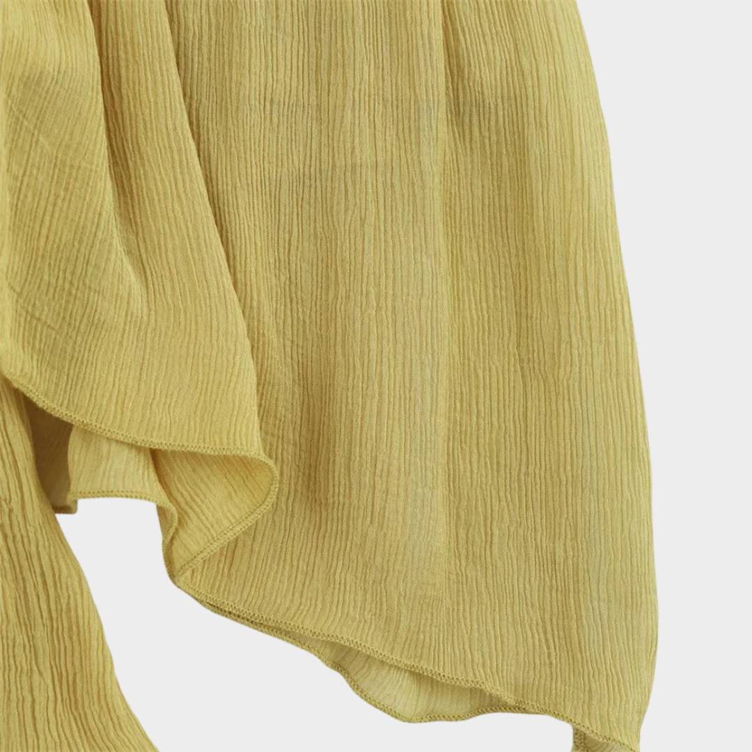 Midilång volangkjol i senapsgul med asymmetrisk fåll och A-linjeform