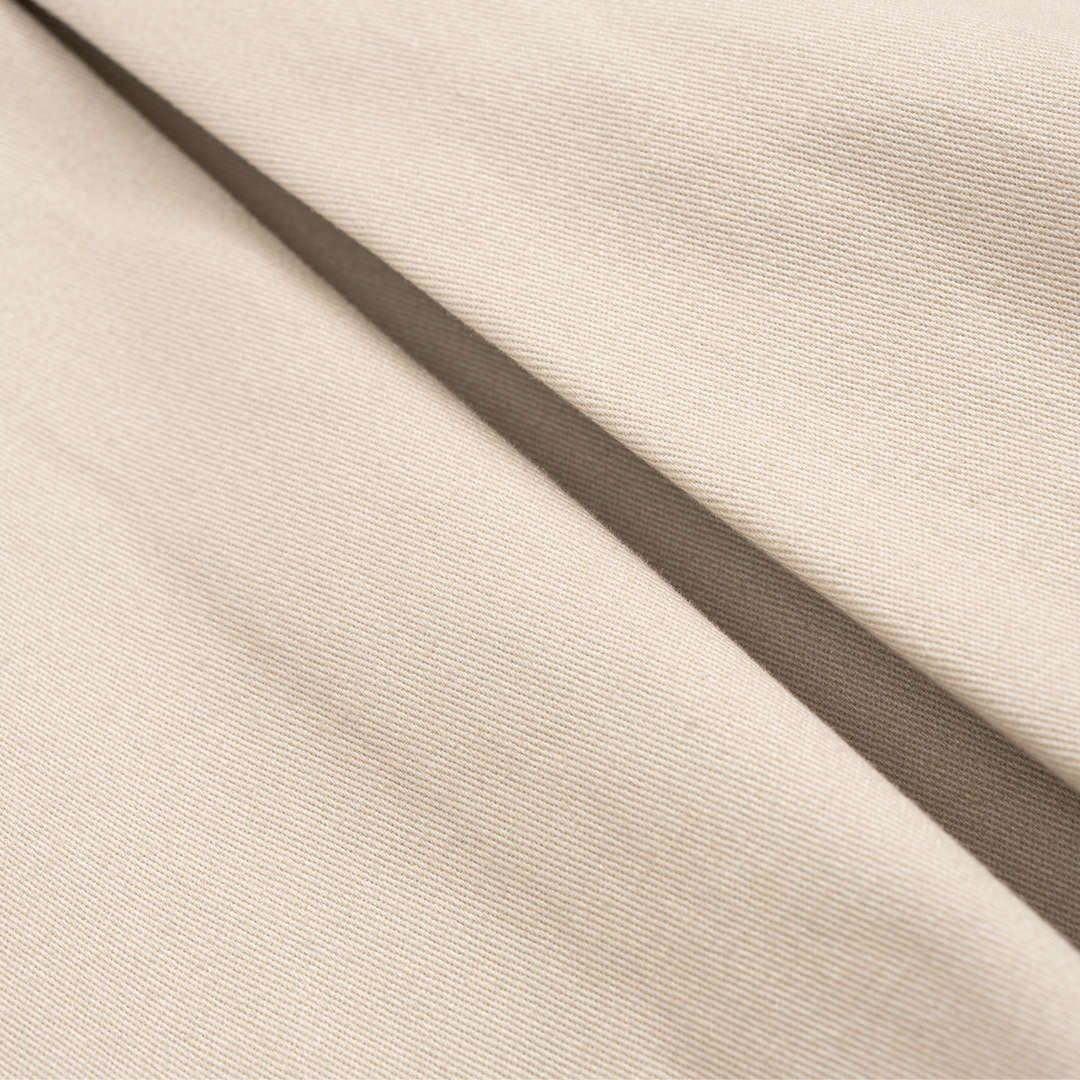 Beige utilityjacka i vävd twill med bälte fickor och voluminösa ärmar