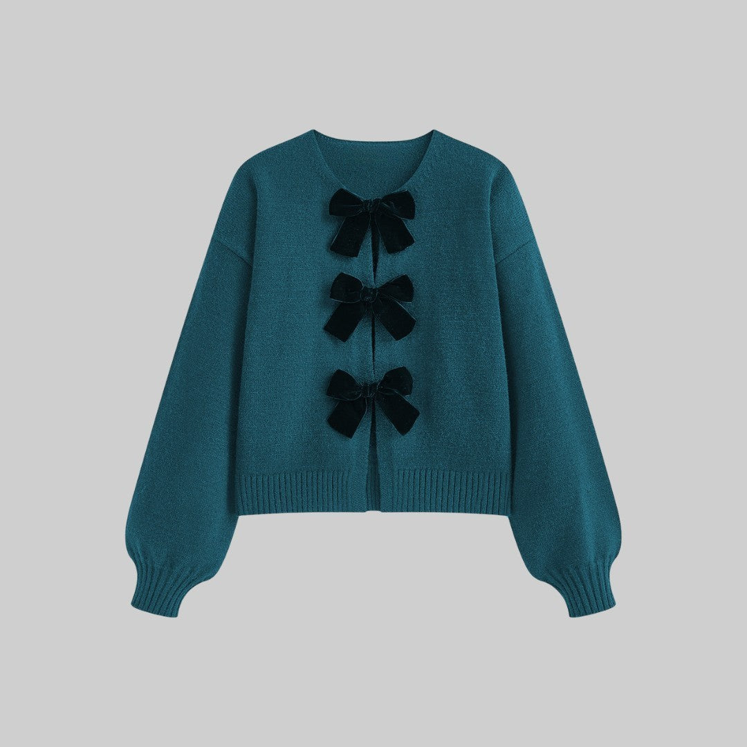 Stickad cardigan med sammetsrosetter och ballongärmar i mjuk stretchkvalitet