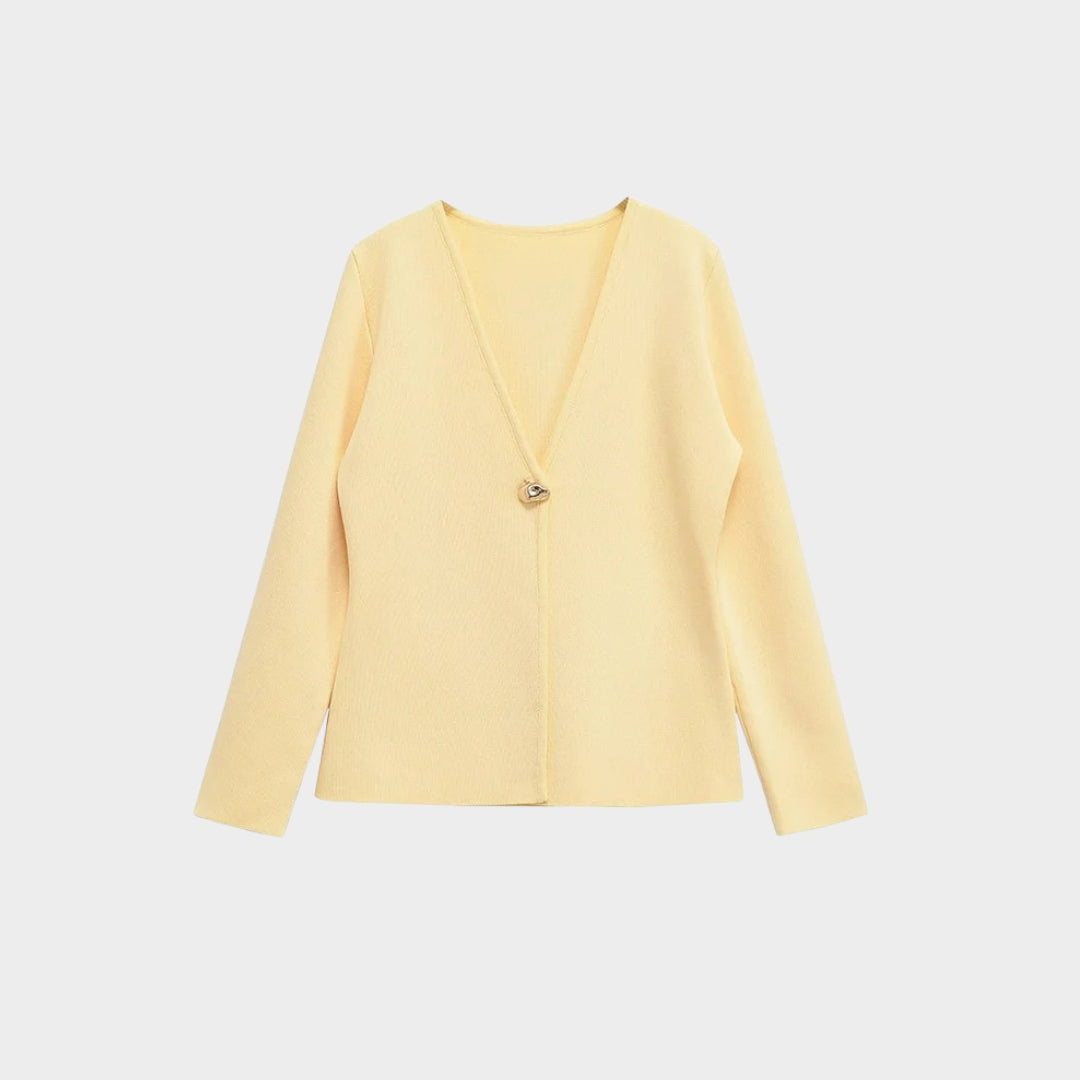 Pastellfärgad stickad kofta med V-ringning och guldfärgad knapp
