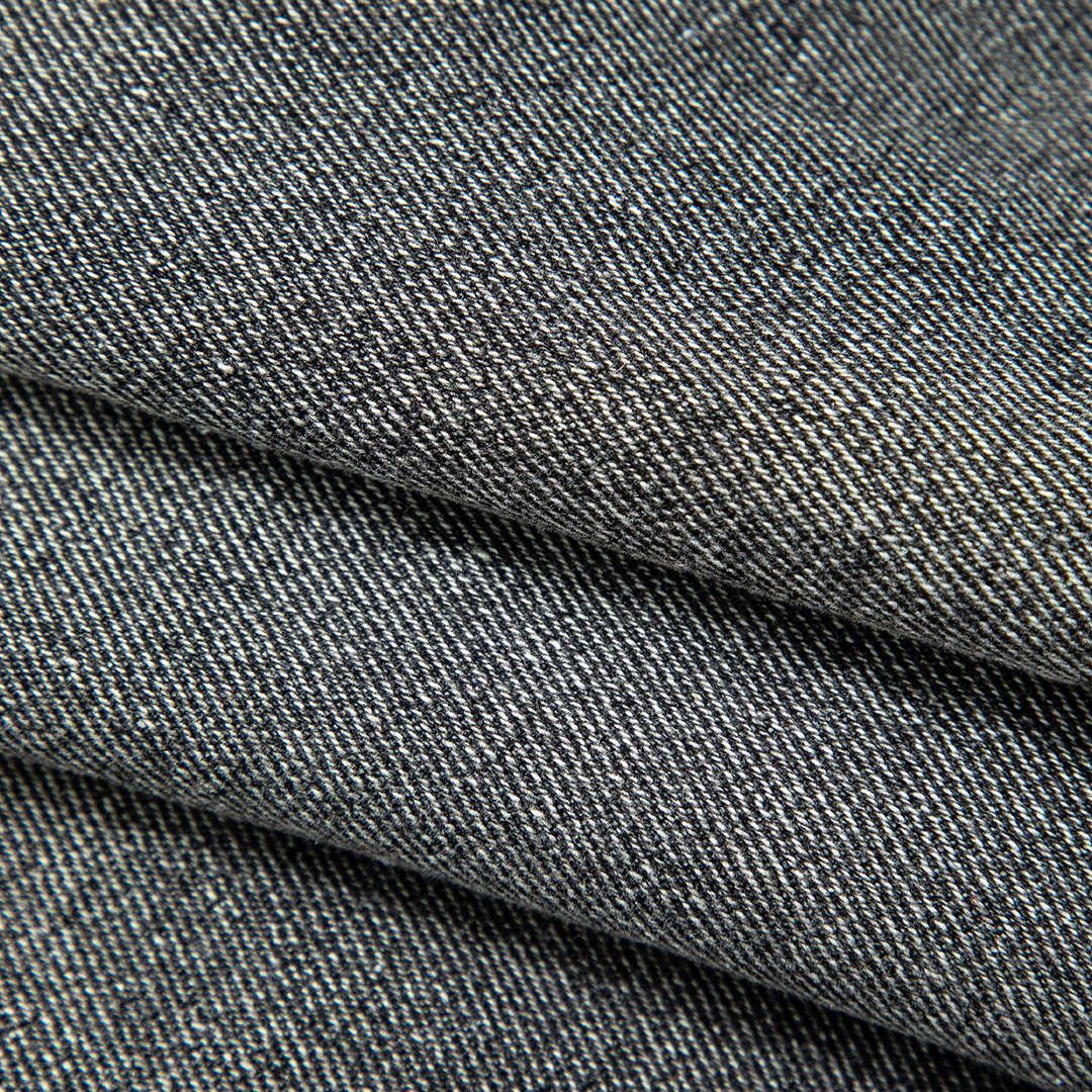 Extra kort ärmlös jeansväst med bröstfickor och tryckknappar i klassisk denim