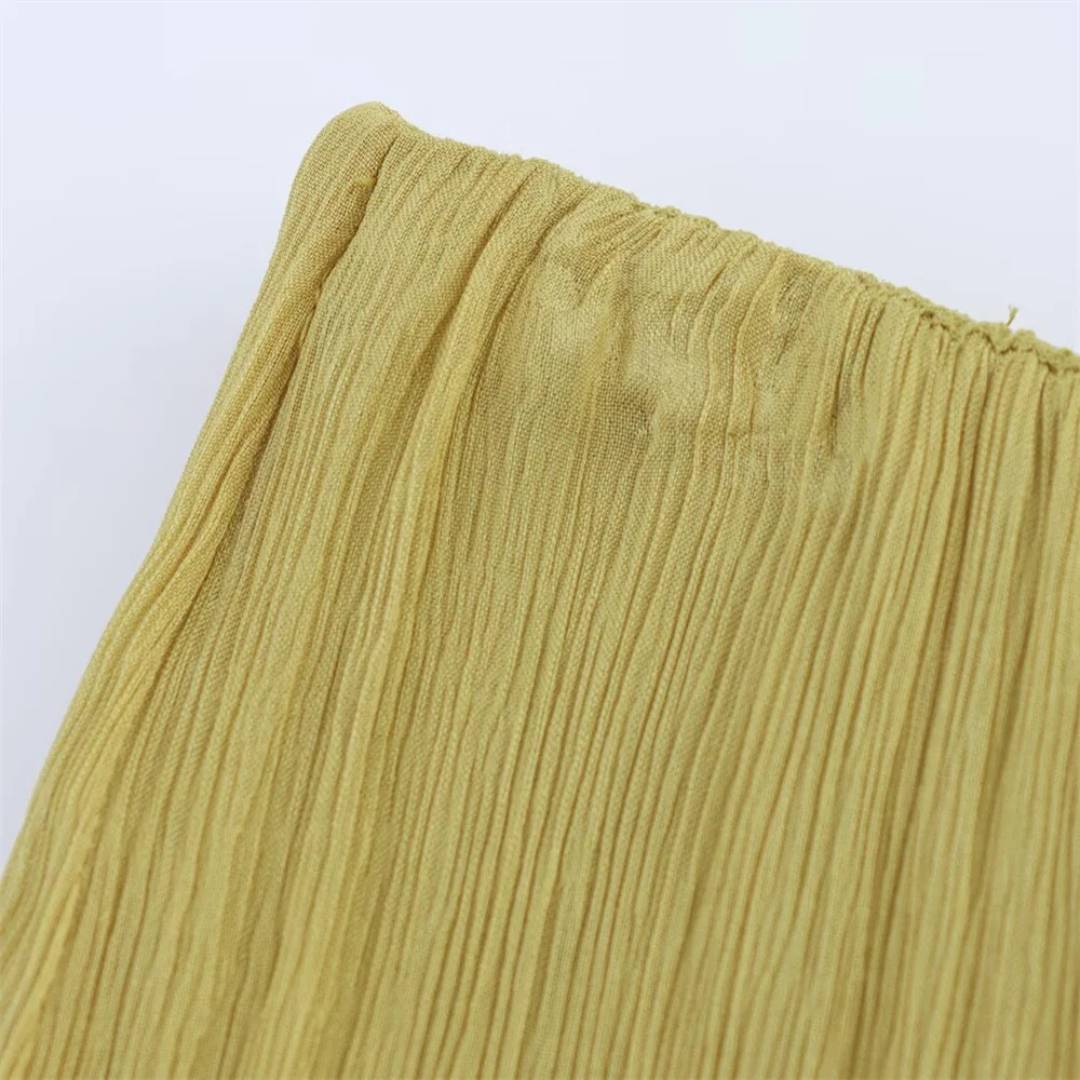 Midilång volangkjol i senapsgul med asymmetrisk fåll och A-linjeform